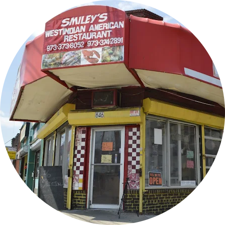 Smiley's West Indian American Restaurant logo